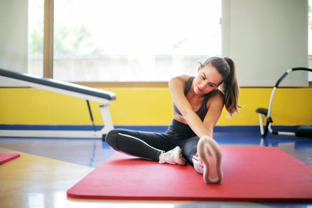 Woman stretching at gym